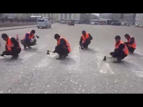 Russian Road Crew Removes a Crosswalk with Hatchet